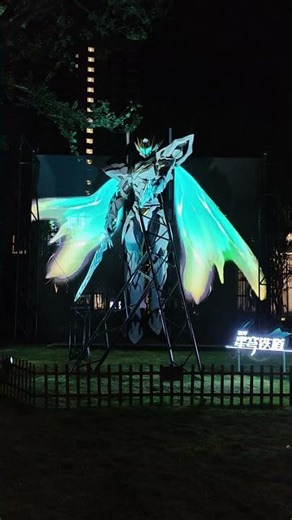 This 8m Robot Unleashes Holographic Wings