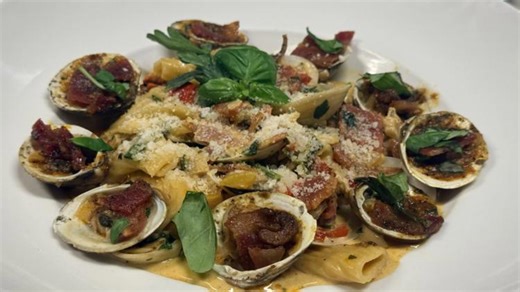 Olivia's prepares a Baked Clams Casino over rigatoni