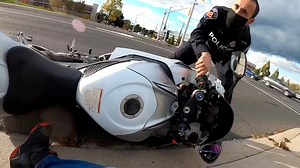 Hamilton police review video that appears to show officer pulling man off motorcycle | CBC News