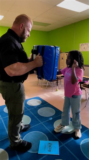 Layla Wilson shows confidence with SRO Larry McMahan. | Rutherford County Sheriff's Office