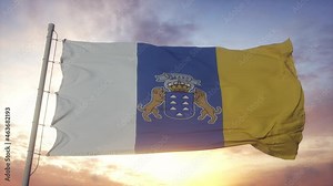 Canary Islands flag, Spain, waving in the wind, sky and sun background