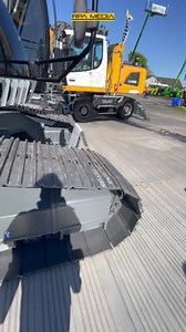 Sam Milne's new Liebherr Construction R 914 Compact High-Walker on the stand at Scotplant. Finished in a deep black livery and fitted with a Steelwrist UK tilt rotator and a rake of MittX light bars from S type X | RPA Media