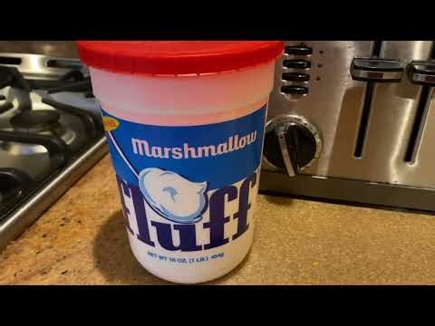Making a peanut butter and Fluff sandwich