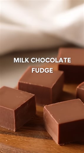 This ultra-creamy Milk Chocolate Fudge is the ultimate three-ingredient treat that melts in your mouth with every velvety bite! 🍫✨ 🛒 Ingredients : 3 cups (510g) Milk chocolate chips 1 can (14 oz / 397g) Sweetened condensed milk 2 tbsp (28g) Unsalted butter 1 tsp (5ml) Vanilla extract 1/4 tsp Salt 👩‍🍳 Easy Steps : 🥣 Prep the Pan - Line an 8x8 inch square baking tin with parchment paper, ensuring there is a slight overhang on the sides to easily lift the fudge out once it has set. 🍳 Melt and