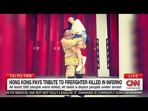 Hong Kong lays to rest "selfless" firefighter killed battling inferno that rocked city