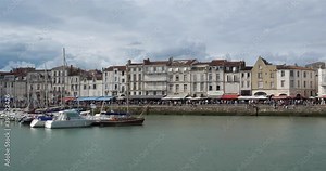 La Rochelle,Charente Maritime department, Region Nouvelle Aquitaine, France. View of the old harbour. On the left side is the Grosse Horloge tower.