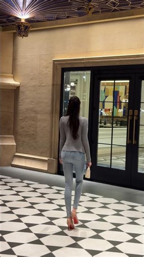 Rear view of a beautiful woman with long, shapely legs wearing tight jeans. #beauty #beautiful