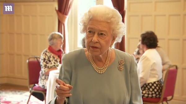 Cheerful Queen jokes as she cuts a cake ahead of upcoming Platinum Jublilee
