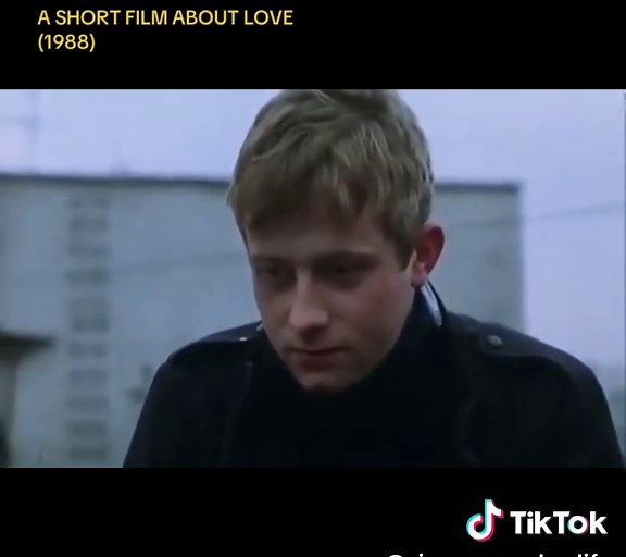 A Short Film About Love (1988) #KrzysztofKieślowski #OlafLubaszenko A naive inexperienced young man spies on a woman who lives across the courtyard, and falls in love with her. He starts using tricks which he hopes will lead to them meeting.