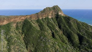 Flying close to Diamond Head Mountain volcano summit and hiking attraction