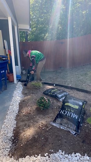 Landscape Install at my house. Created a bed planted two encore azaleas and a pampas grass. Installed black metal landscape edging, white marble rock, and black mulch. #mowitwells #landscaping | Mow It Wells