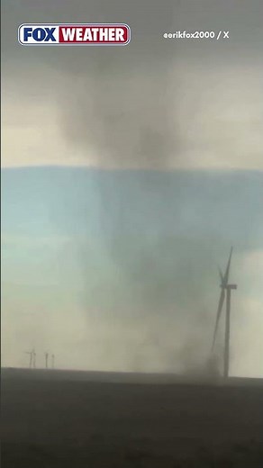 Landspout Swirls Amid Field Of Windmills