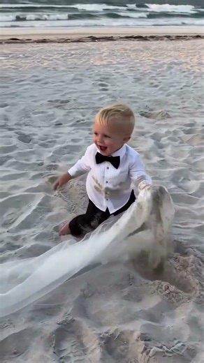 Ring Baby Yells 'I GOT IT!' Dives to Save Bride's Veil at Beach Wedding 🌊👰