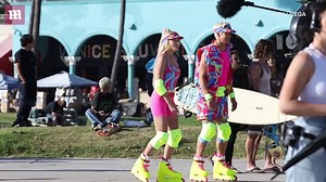 Margot Robbie and Ryan Gosling roller-skate on 'Barbie' set