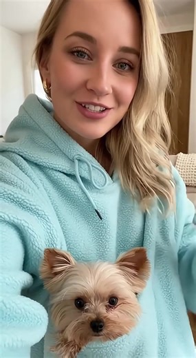 "This soft blue sherpa hoodie = my Yorkie’s new happy place. Oversized...