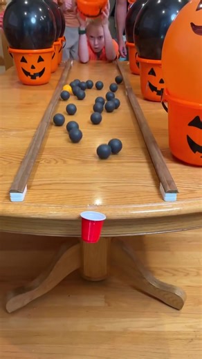 Ping Pong Pumpkin Challenge 🎃 PART 3 The whole family plays a funny Halloween party game where they pour ping pong balls across the table and try to get one in the tiny cup. Whoever gets the orange Jack-O-Lantern ball in, gets a special prize "🎬 This video was produced by Network Media and Benson Bros" | Play Together Stay Together