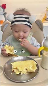 11-month-old baby immersively eating cakes and cute little foodies. How cute is human cubs eatin