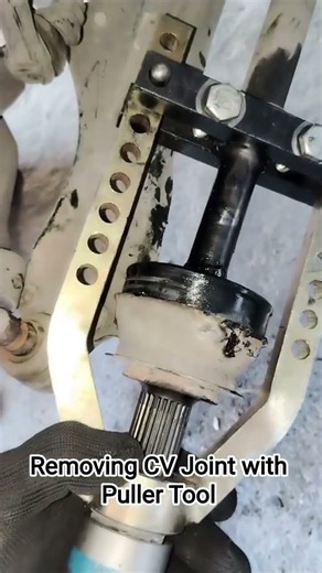 Removing CV Joint with Puller Tool