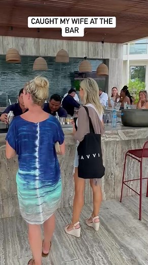 Caught my wife ordering a drink at the bar after she said we were going to the gym Do I join her? #wife #couple #couplegoals #vacation | Tom Challan