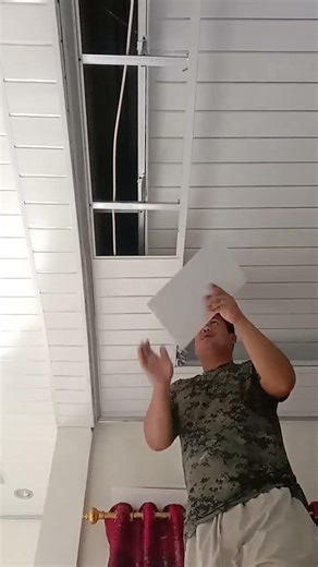 This is the process of installing the underside of a drop ceiling.