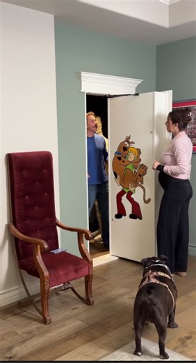 She didn’t expect a secret door behind the bookcase!