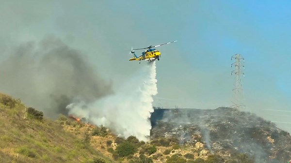Brush fire breaks out, spreads from Santa Clara River bottom