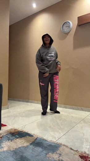 Energetic Dance Performance in Venom Sweatpants