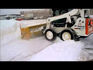 Bobcat S650 skidsteer plowing snow live edge metal pless snowpusher