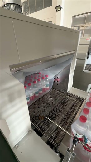 Semi-automatic heat shrink film packaging machine #packagingmachine #shrinkwrappingmachine #factory