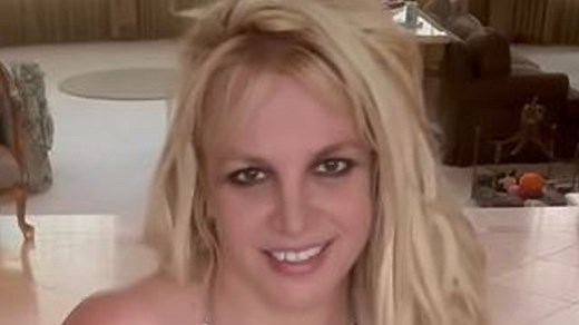 Britney Spears strips down to a see-through thong bodysuit and dances