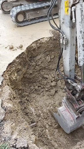Terex Excavator Digging Trench on Construction Site