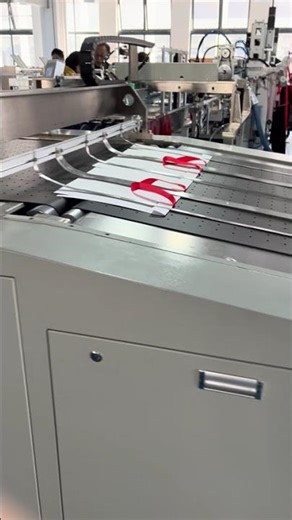 Automatic paper bag ribbon threading and bag making machine. #ribbonpastingmachine #paperbagmachine