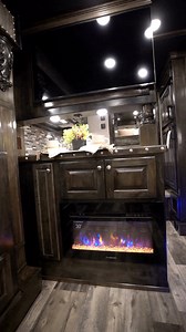 2.4K views · 27 reactions | ✨ Feature Friday ✨This modern fireplace is the perfect blend of style and function for any custom interior! Surrounded by stunning maple hardwood cabinets, it brings both warmth and a sleek aesthetic to your LQ. #FeatureFriday #CustomInteriors #CozyVibes #ModernLiving #InteriorInspiration | Outlaw Conversions | Facebook