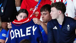 Olympic diver Tom Daley shows off his knitting skills while cheering on his teammates