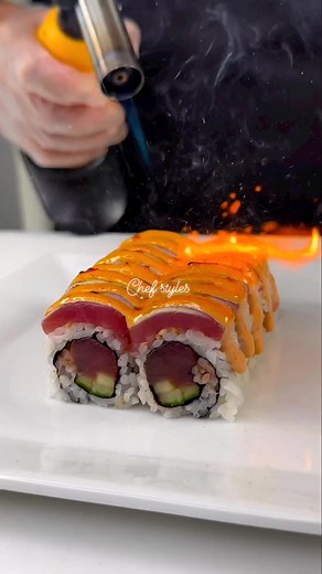 25K views · 282 reactions | DYNAMITE ROLL Just one bite will have your tastebuds exploding with flavor! Fresh yellowfin spicy tuna, & cucumber inside, rolled up and topped with torched tuna, spicy mayo, togarashi & scallion. Would you take a bite? | CHEF Styles | Facebook