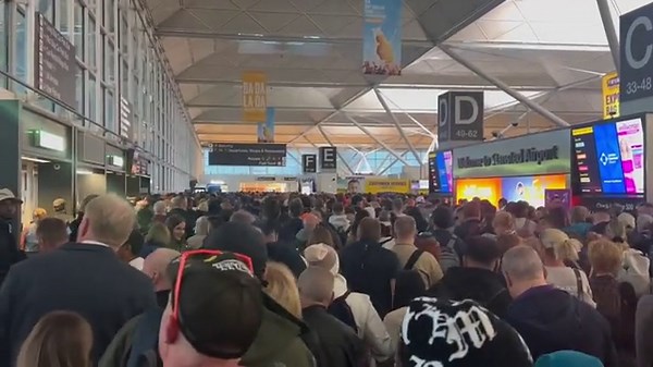 Chaos at Stansted Airport as passengers swarm security gates after fire in departure lounge
