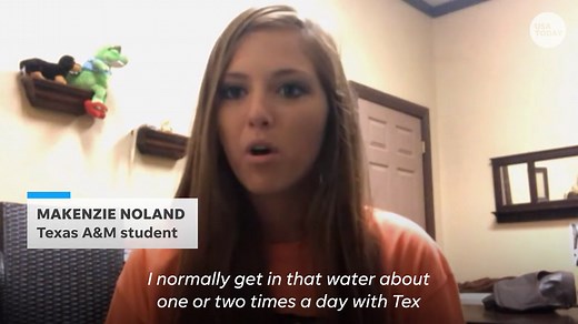 Intern cozies up with 14-foot gator for graduation pics