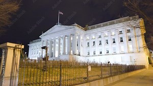 The Treasury Building, the headquarters of the United States Department of the Treasury, seen from the intersection of Pennsylvania Avenue NW and 15th Street NW in Washington, DC. on a winter night.