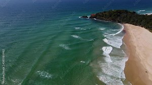 Ocean Waves Rolling At The Fingal Head Beach - Surfing Destination In Summer - Fingal Head Causeway And Lighthouse - New South Wales, Australia. - aerial drone shot