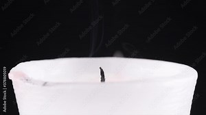 candle turning off by drop of water in slow motion