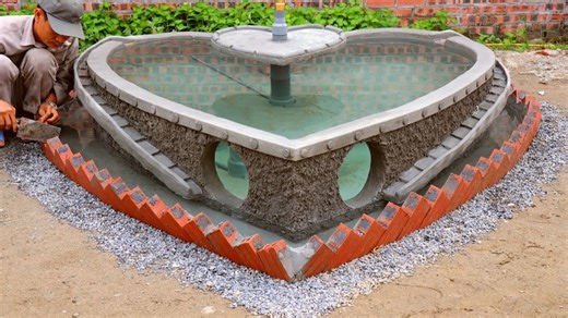 Building a heart-shaped garden aquarium from cement & brick