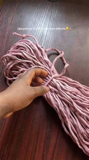 Upcycle scrap T-shirt yarn with me ♻️🧶 Steps to make your yarn new again: 1.Fold into a loose circle using your hand or a chair 2.Tie in a few places to avoid tangling 3.Soak in lukewarm soapy water, gently rubbing with your hands Leave for 15 minutes, moving it occasionally 4.Rinse well and press with a towel 5.Air-dry, then wind your yarn and it’s ready to use ✨ Watch out for Part Two to see what I make with it 👀🤍 #snuggstudio #upcycle #yarn #crochet #tshirtyarn