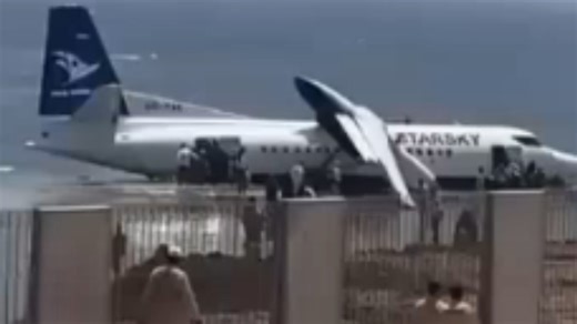 Passengers climb from wreckage unhurt after jet crashes into Somalia beach on takeoff