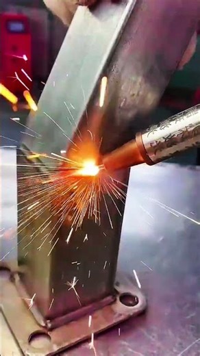 Nested square metal tubes form adjustable joint on base plate