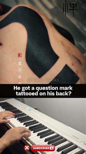 He got a question mark tattooed on his back?