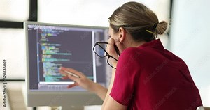 Woman programmer conducts remote self-test and IT. Design skills and online html text for cybersecurity staff