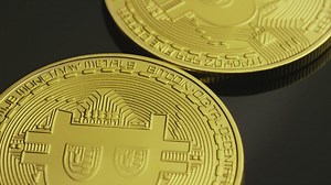 Golden bitcoin coins in a close-up shot - Free Stock Video