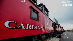 Iconic red cabooses at Cardinal Stadium are still caught up in a fight over money