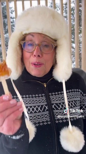 ❄️If you don’t have snow you can crush ice in blender and put over a cookie sheet ❄️During our visit to Quebec, I was enamored with the charm of the maple taffy vendors on street corners, making the Sugar Shack classic, Maple Taffy. It is such a fun and festive treat that grownups and children will equally enjoy. You just need snow! XO Babs ❄️Maple Taffy 1 cup maple syrup 5-10 wooden sticks (like popsicle sticks) Clean snow ❄️Heat maple syrup over medium-high heat to a boil. Simmer the maple syr