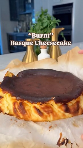 Ereka Vetrini on Instagram: "SAVE my 10 Minute BURNT BASQUE CHEESECAKE for the next time you want to impress your guest with a stunning yet surprisingly easy dessert. RECIPE BELOW Basque Cheesecake Ingredients 2 cups heavy cream 7 eggs 1 ⅔ cup of sugar ½ tsp salt ⅓ cup all purpose flour 1 tsp vanilla 32 ounces full-fat cream cheese zest from 2 orange butter for greasing Preheat oven to 425F To a large blender add heavy cream, eggs, sugar, flour, vanilla, and cream cheese. Blend until smooth and 